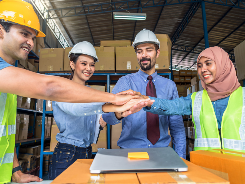 group-of-diversity-warehouse-worker-throwing-helme-2024-10-21-09-44-43-utc
