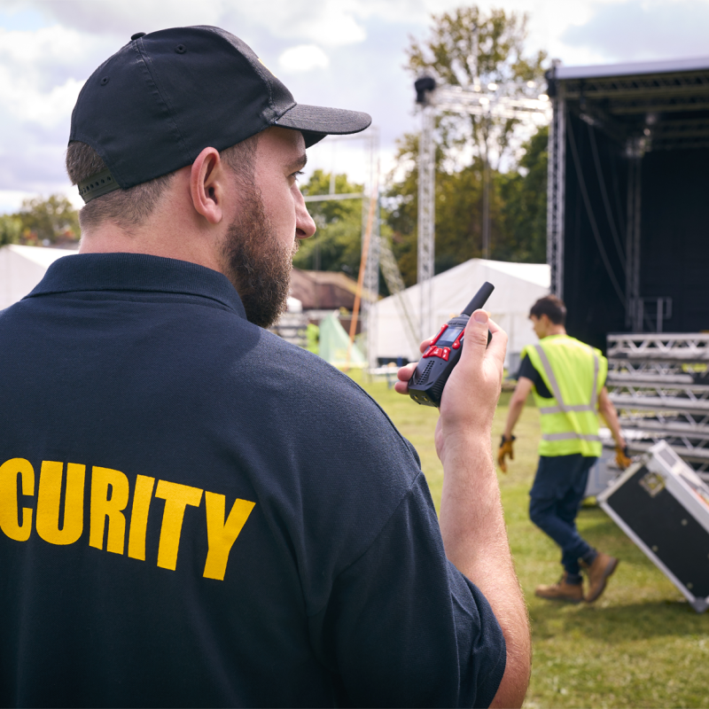 rear-view-of-security-team-at-outdoor-stage-for-mu-2024-10-22-11-36-45-utc